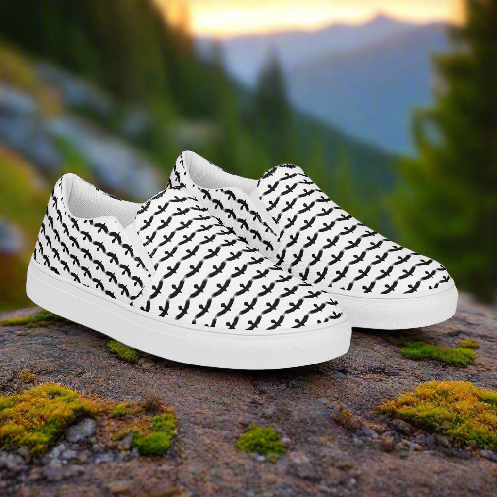 WildSage Market black raven pattern slip on shoes with white sole and black raven design