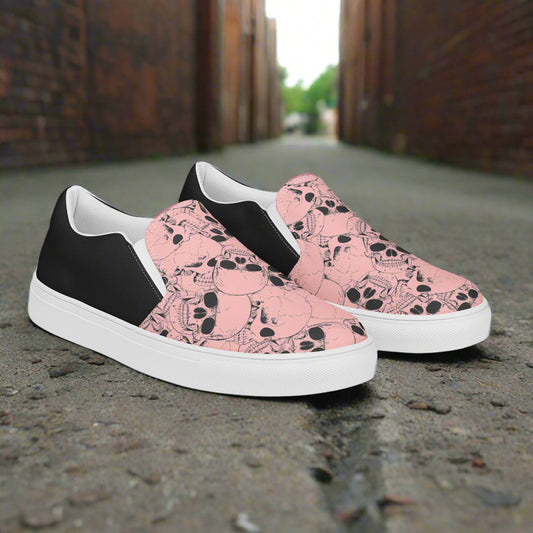WildSage Market slip on pink skull pattern shoes with black heel and white sole on pavement
