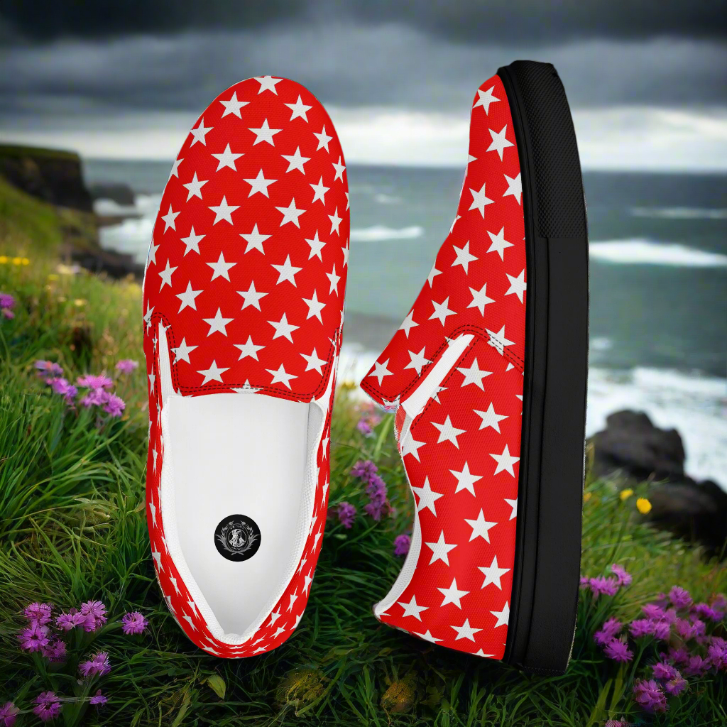 White Star Red Womens Slip On Canvas Shoes by WildSage Market with black sole on grassy cliff background