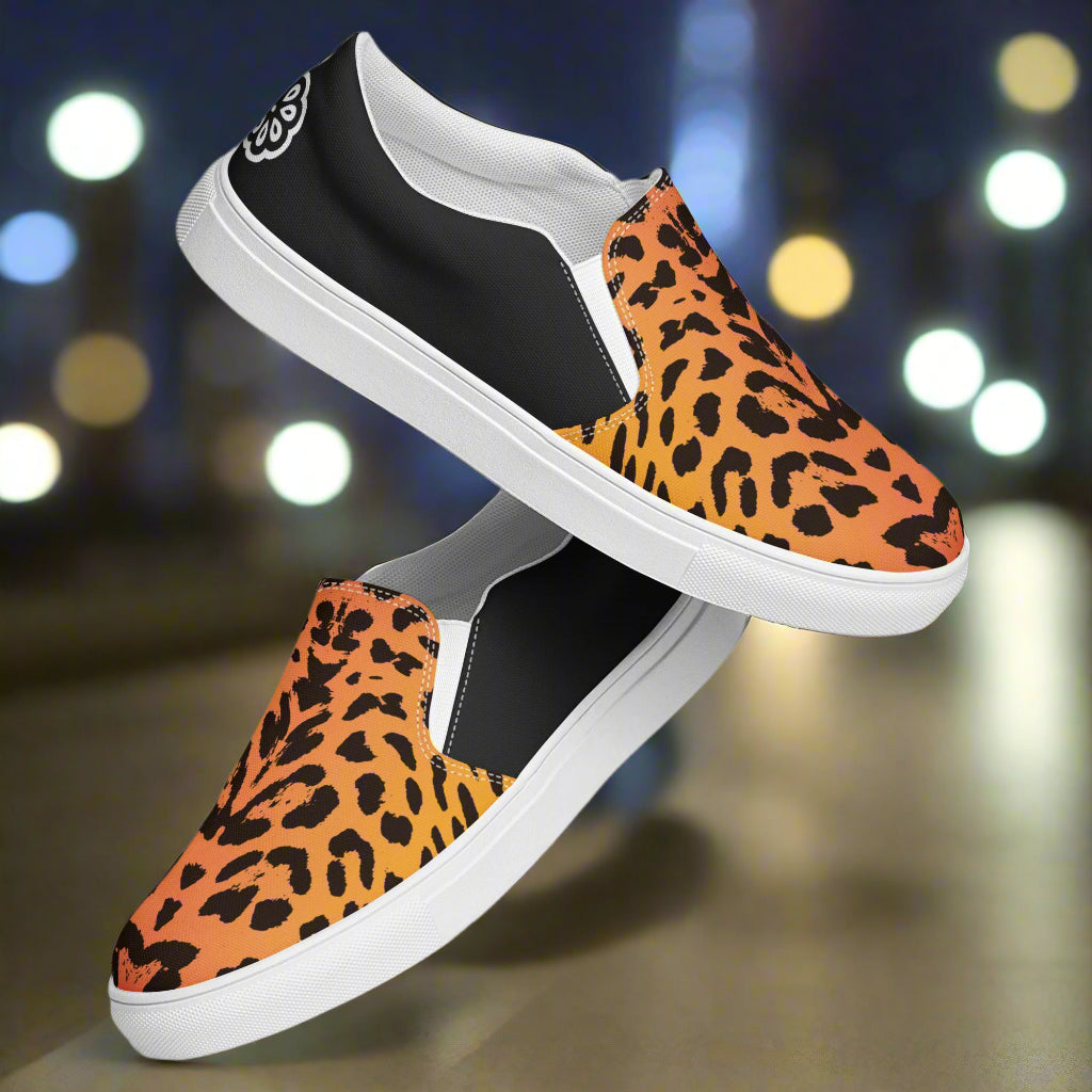 WildSage Market Cheetah Slip-on Canvas Shoes with orange cheetah print, black heel panels and white rubber sole