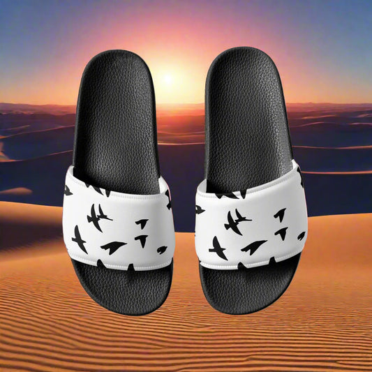 WildSage Market womens blackbird print slides with black soles and white straps featuring black bird silhouettes