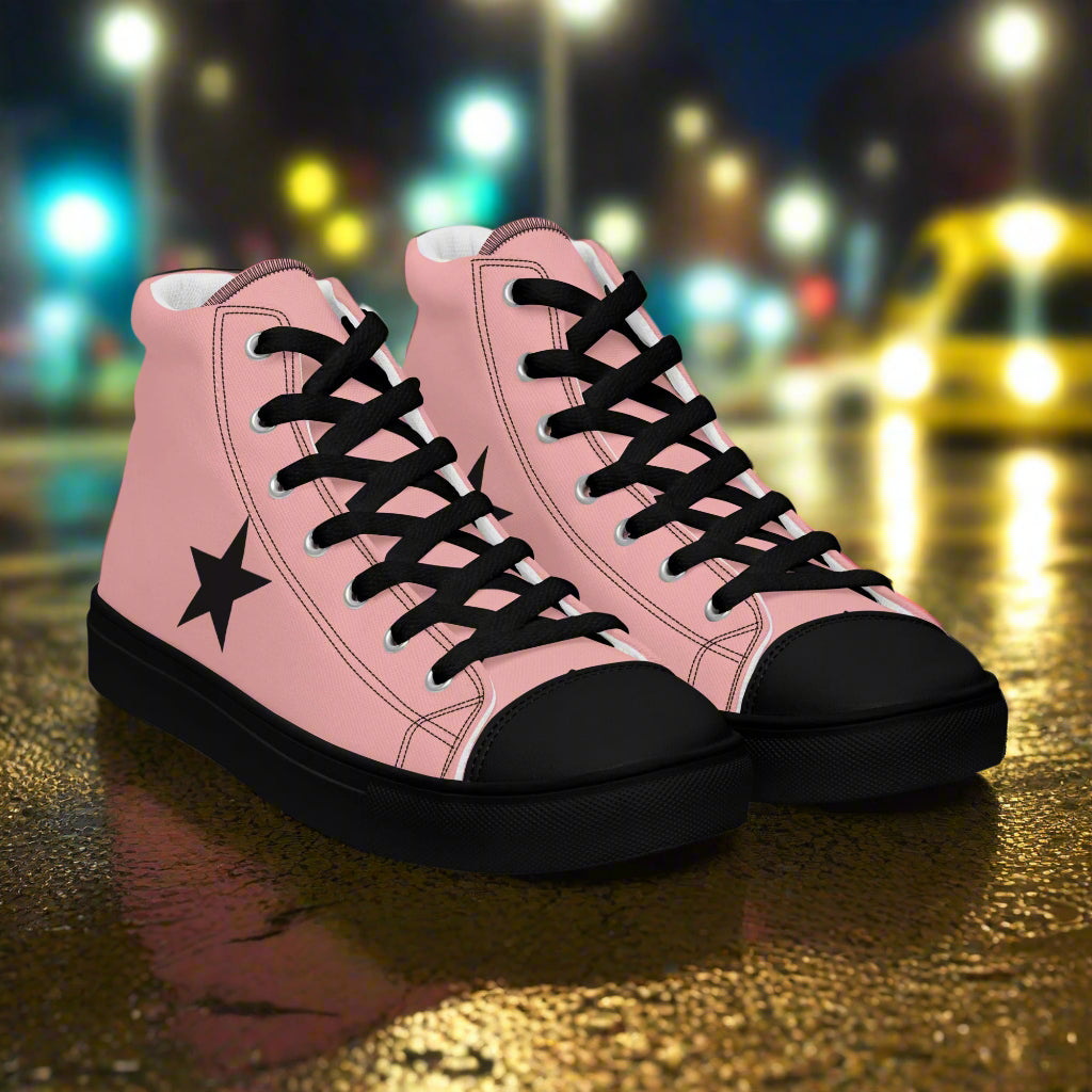 Womens pink high top sneakers with black accents on a wet urban street at night