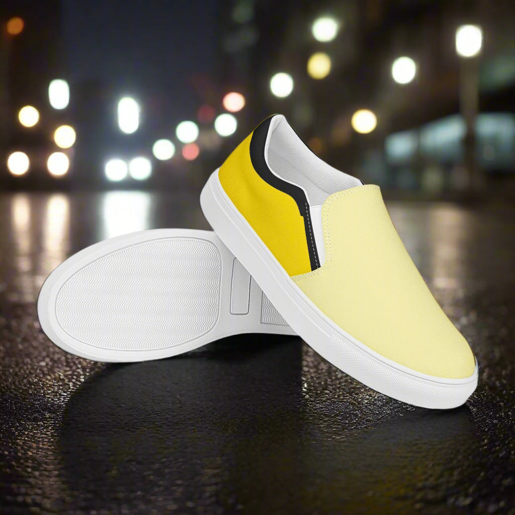 WildSage Market yellow two tone slip on canvas shoes with white soles on dark street background
