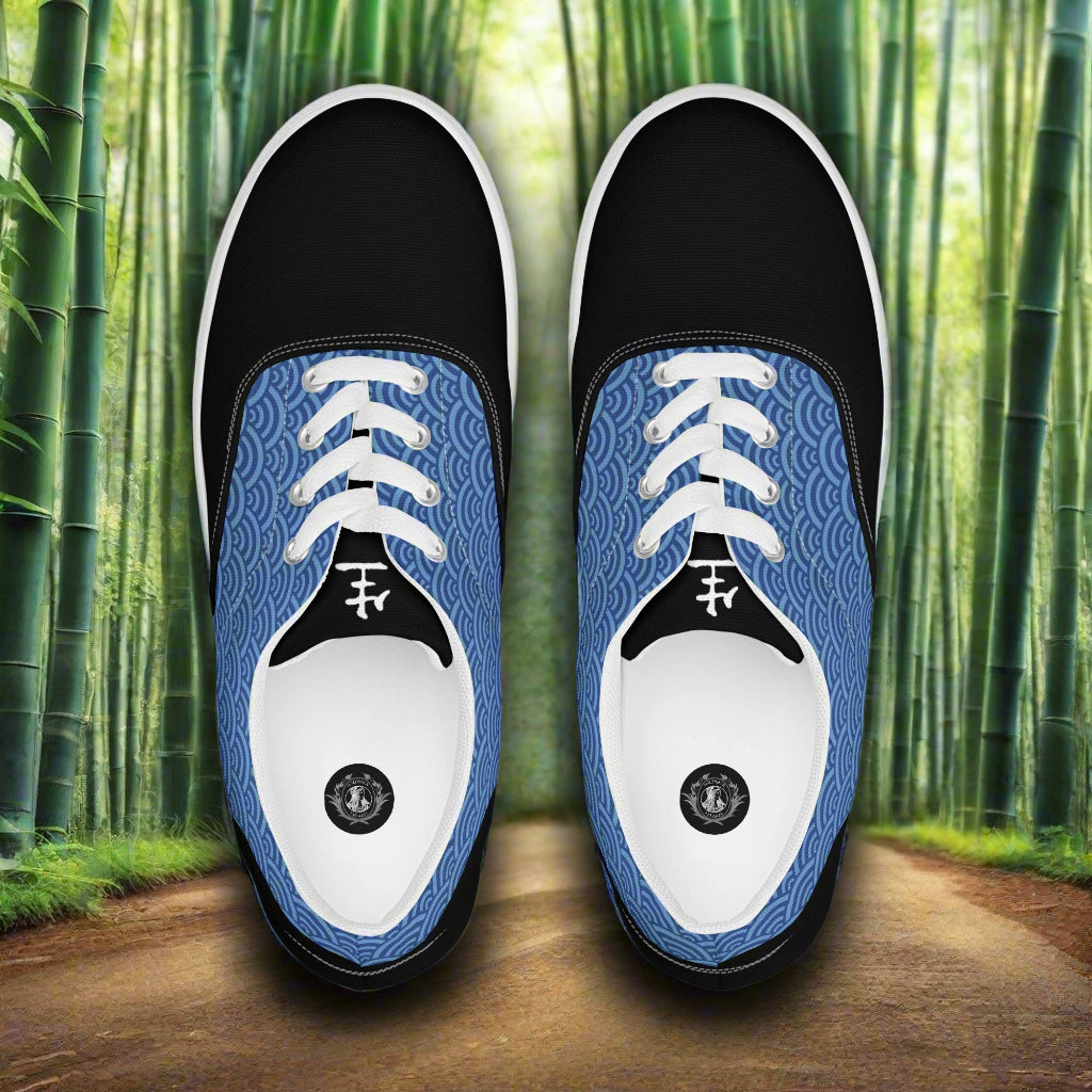 WildSage Market Lace-up Canvas Shoes black toe with blue wave pattern sides and white laces on bamboo path