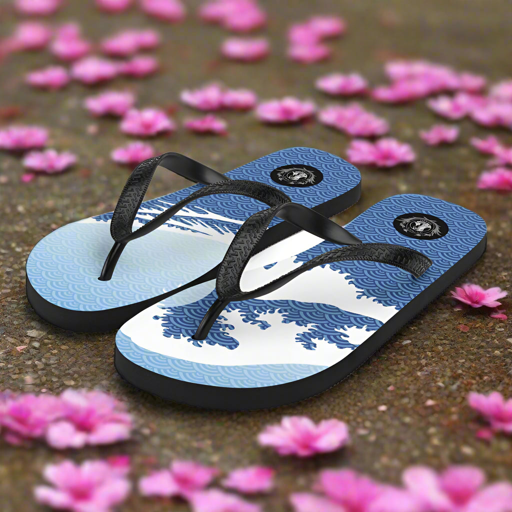 Asian print Tsunami Sky flip-flops with black straps and blue wave design on a floral background