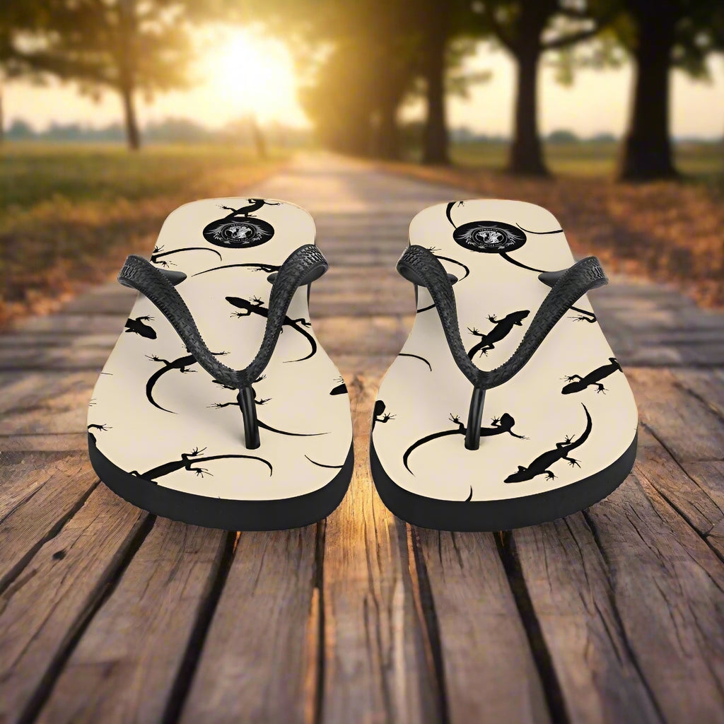 Beige lizard print flip-flops with comfortable straps, perfect for summer outings