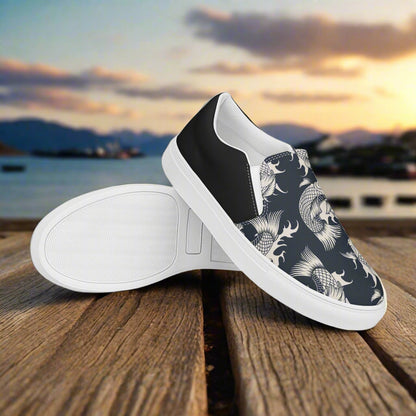 Black Koi Halftone Slip-on Canvas Shoes with unique design on a wooden surface by the water