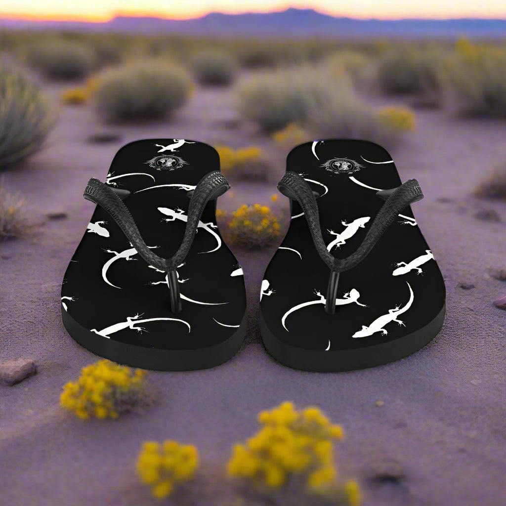 WildSage Market black lizard print flip-flops featuring a stylish lizard design on a comfortable sole