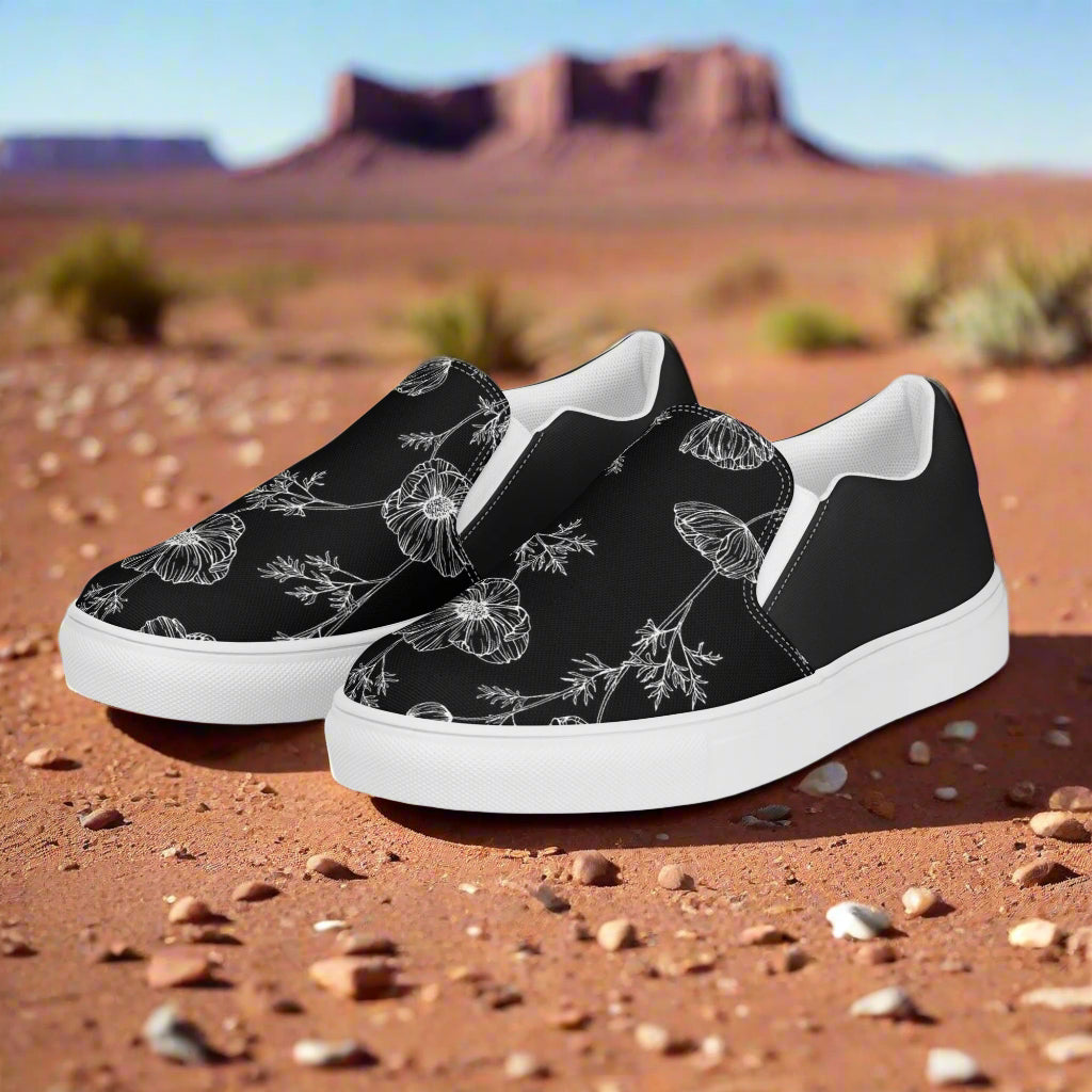 Black Poppy Halftone Slip-on Canvas Shoes featuring floral design on a desert background