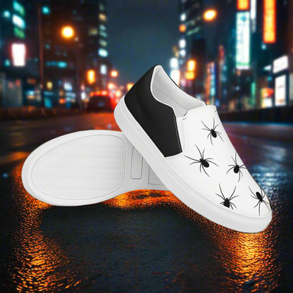 Black Spiders Halftone Slip-On Canvas Shoes featuring a stylish spider print on a white background