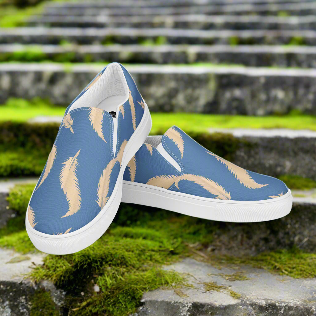 Blue Feather Slip-on Canvas Shoes featuring a stylish feather pattern on a blue background