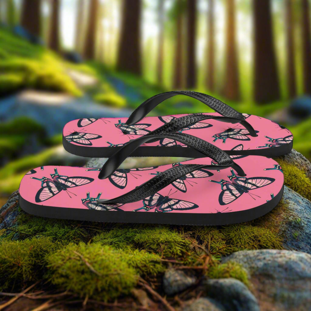WildSage Market butterfly print flip-flops on a natural background with vibrant colors