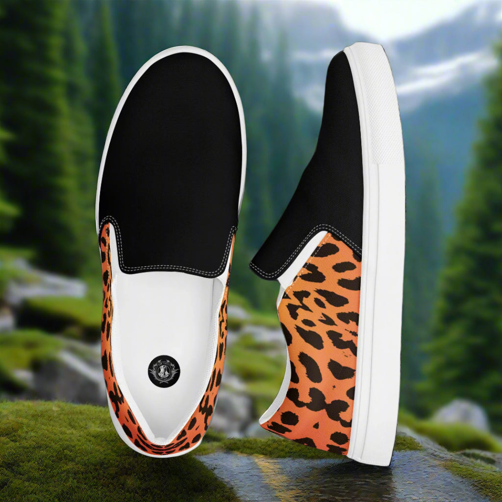 Cheetah Two Tone Slip-on Canvas Shoes featuring a black and orange leopard print design