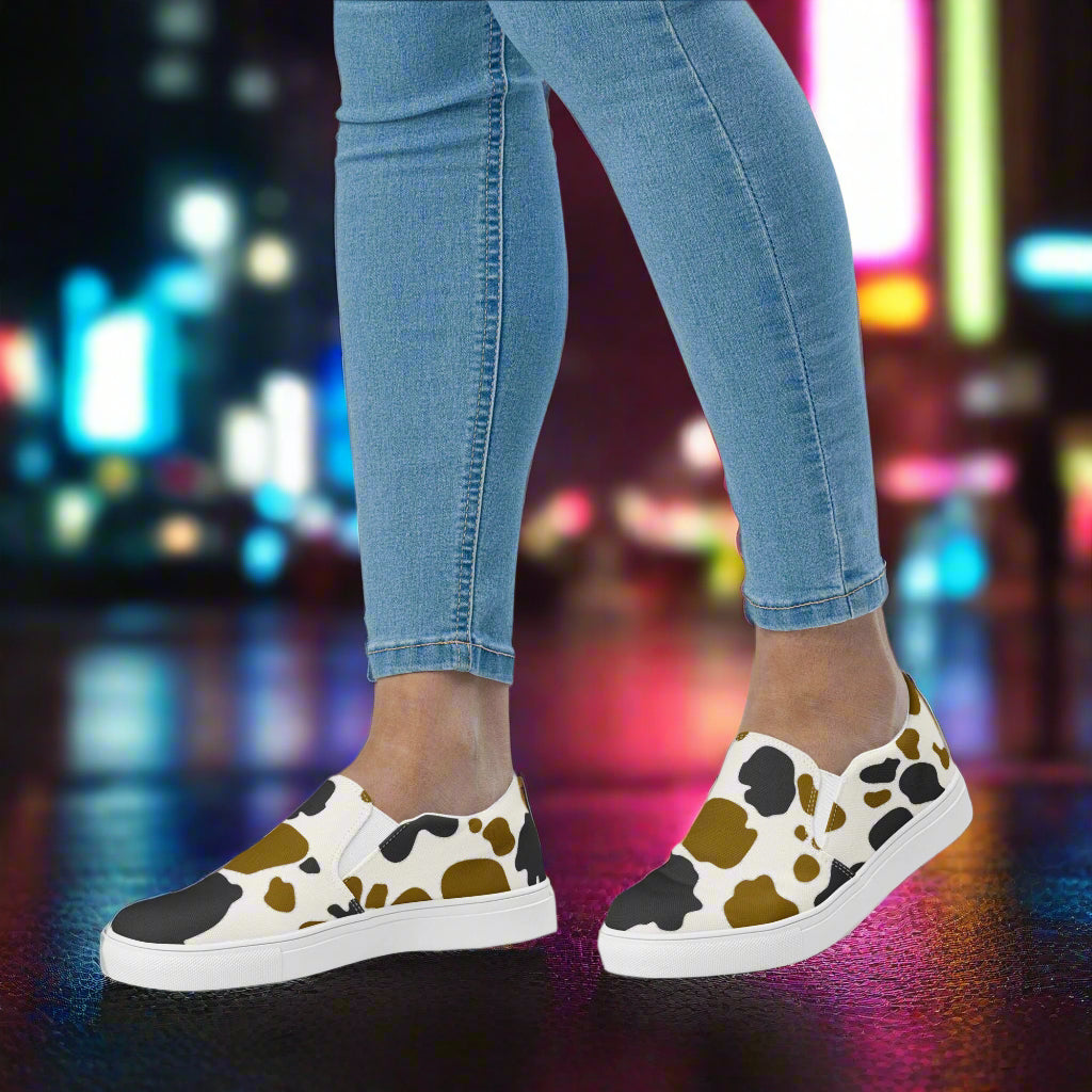 Cowhide Brown and Black Slip-on Canvas Shoes worn with jeans on a vibrant city street backdrop