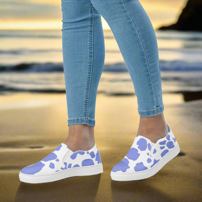 WildSage Cowhide Purple Slip-on Canvas Shoes showcased on a beach with casual jeans