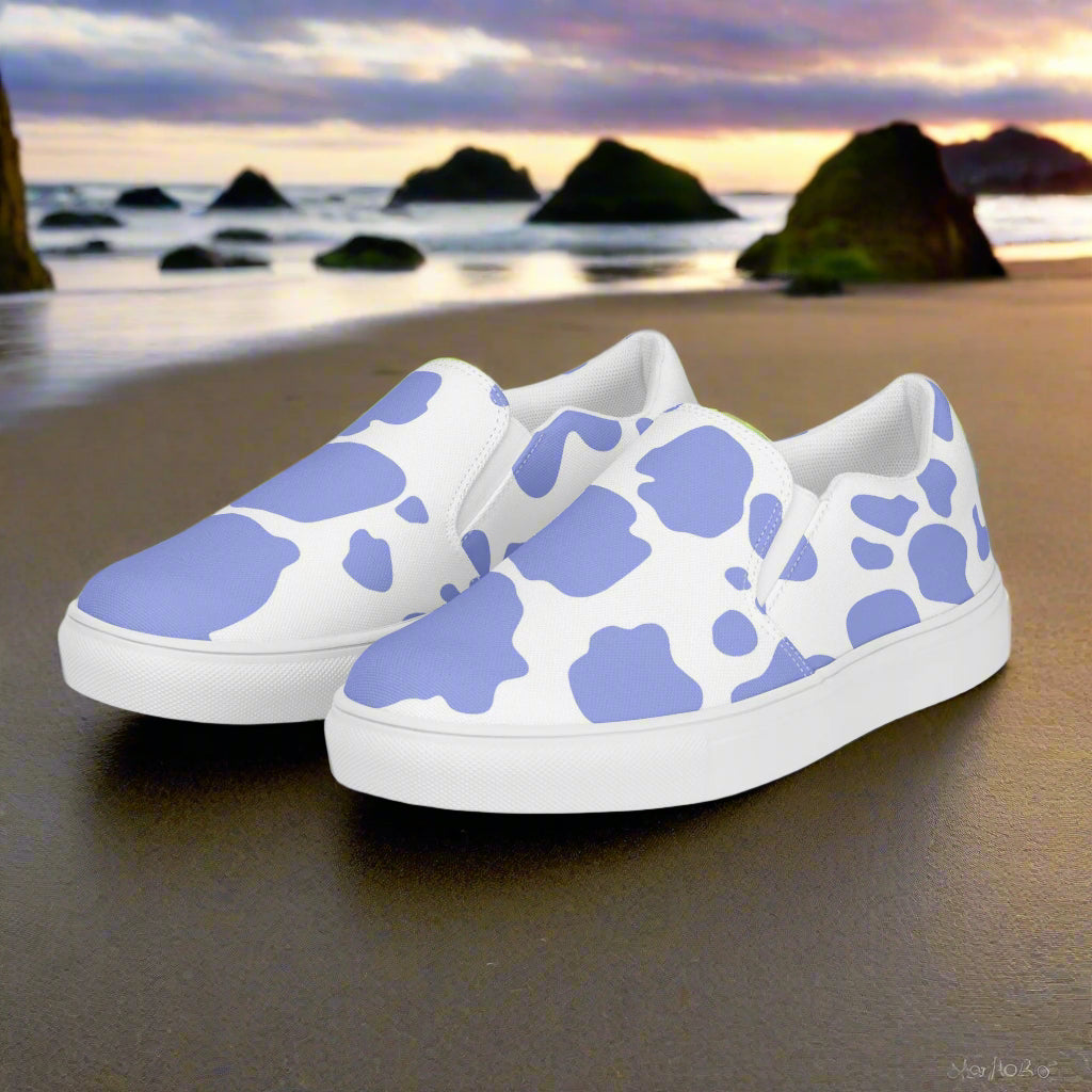 WildSage Cowhide Purple Slip-on Canvas Shoes on a beach with scenic sunset background