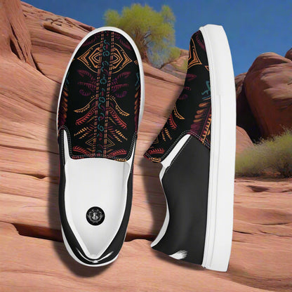 Iktomi Halftone Slip-on Canvas Shoes featuring a vibrant tribal design on a black background