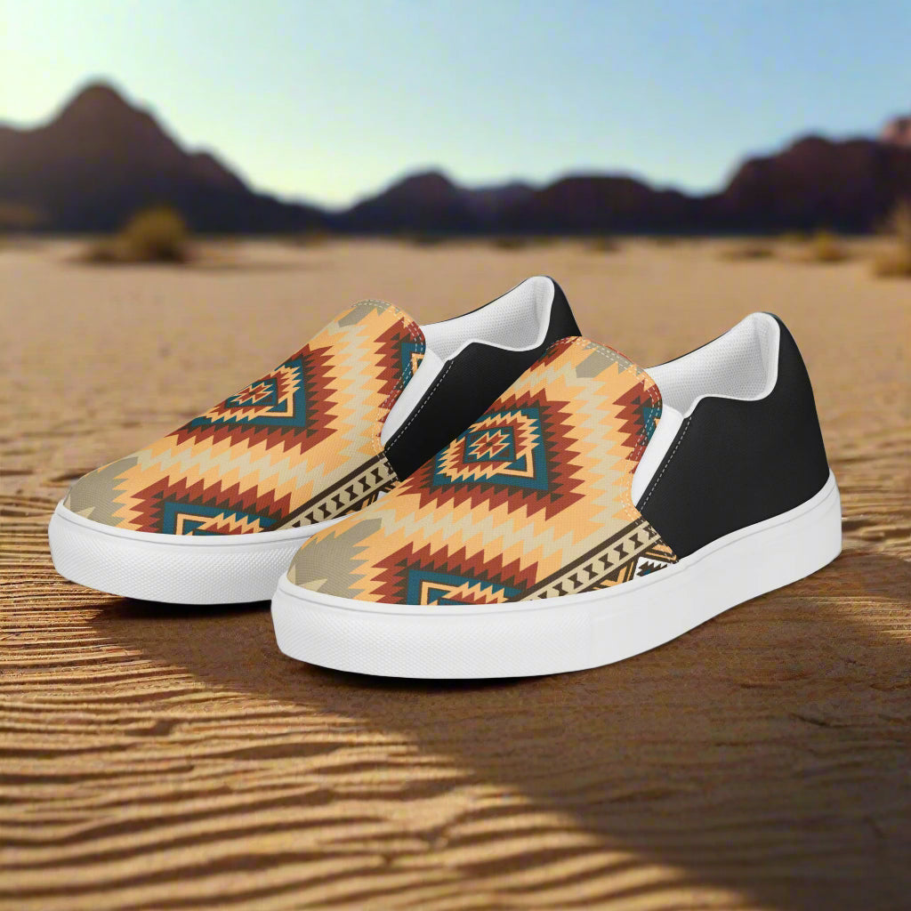 Kayenta Halftone Slip-on Canvas Shoes featuring a vibrant geometric pattern on a sandy background