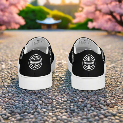 Longevity Black Slip-on Canvas Shoes featuring a minimalist design with logo at the rear