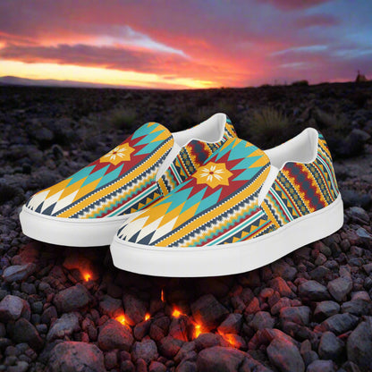 Nakona Southwest Print Slip-on Canvas Shoes featuring vibrant tribal patterns on a scenic background