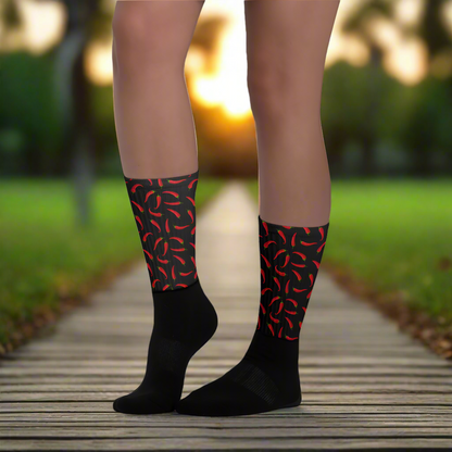 Red and black hot chili socks featuring a vibrant chili pepper design, perfect for adding flair to your outfit