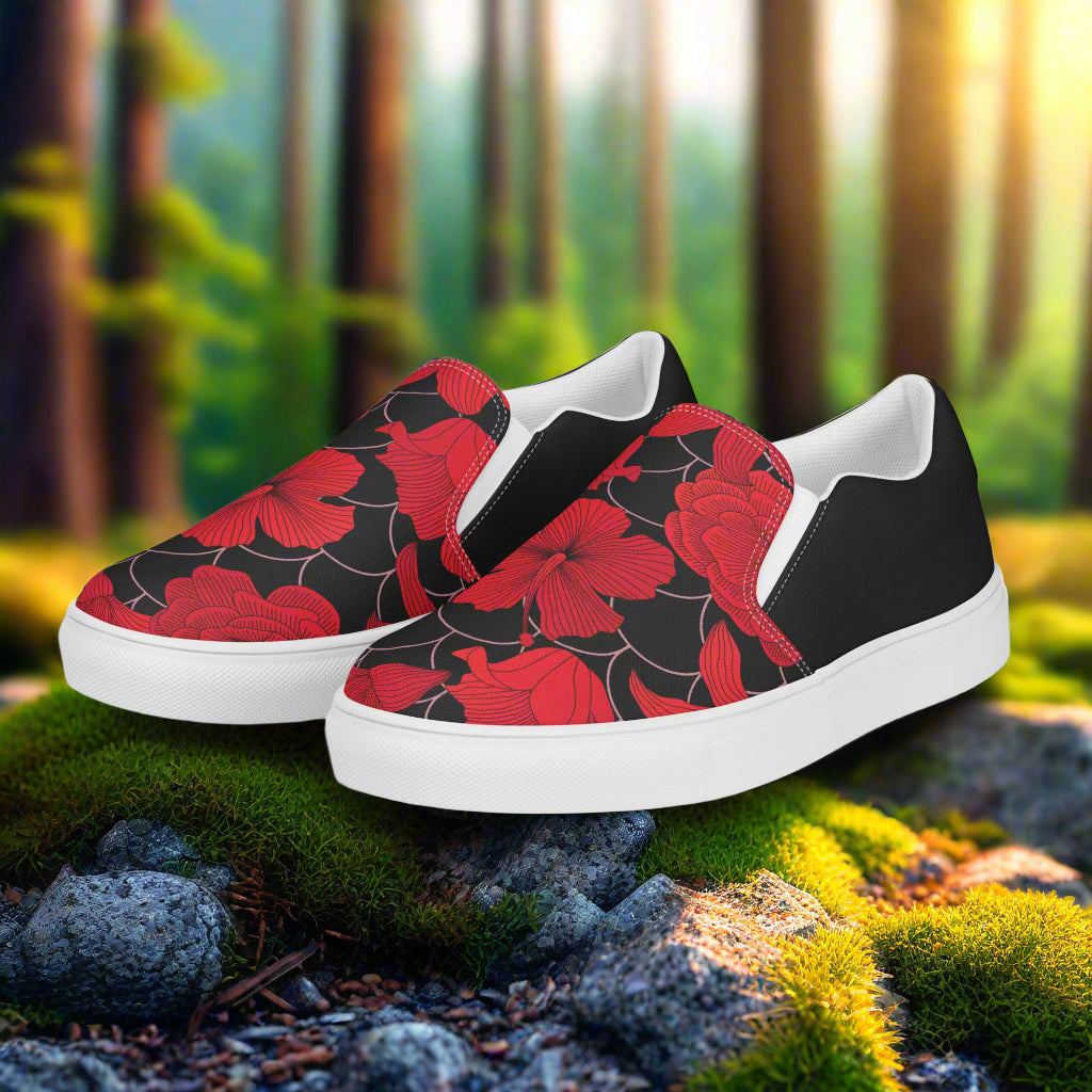 Red Lily Halftone Slip-on Canvas Shoes featuring a vibrant floral design on a black background