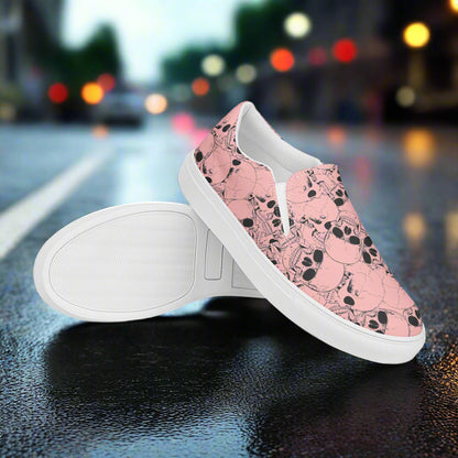 WildSage Market slip on shoes featuring a pink skull pattern with white soles on a street background