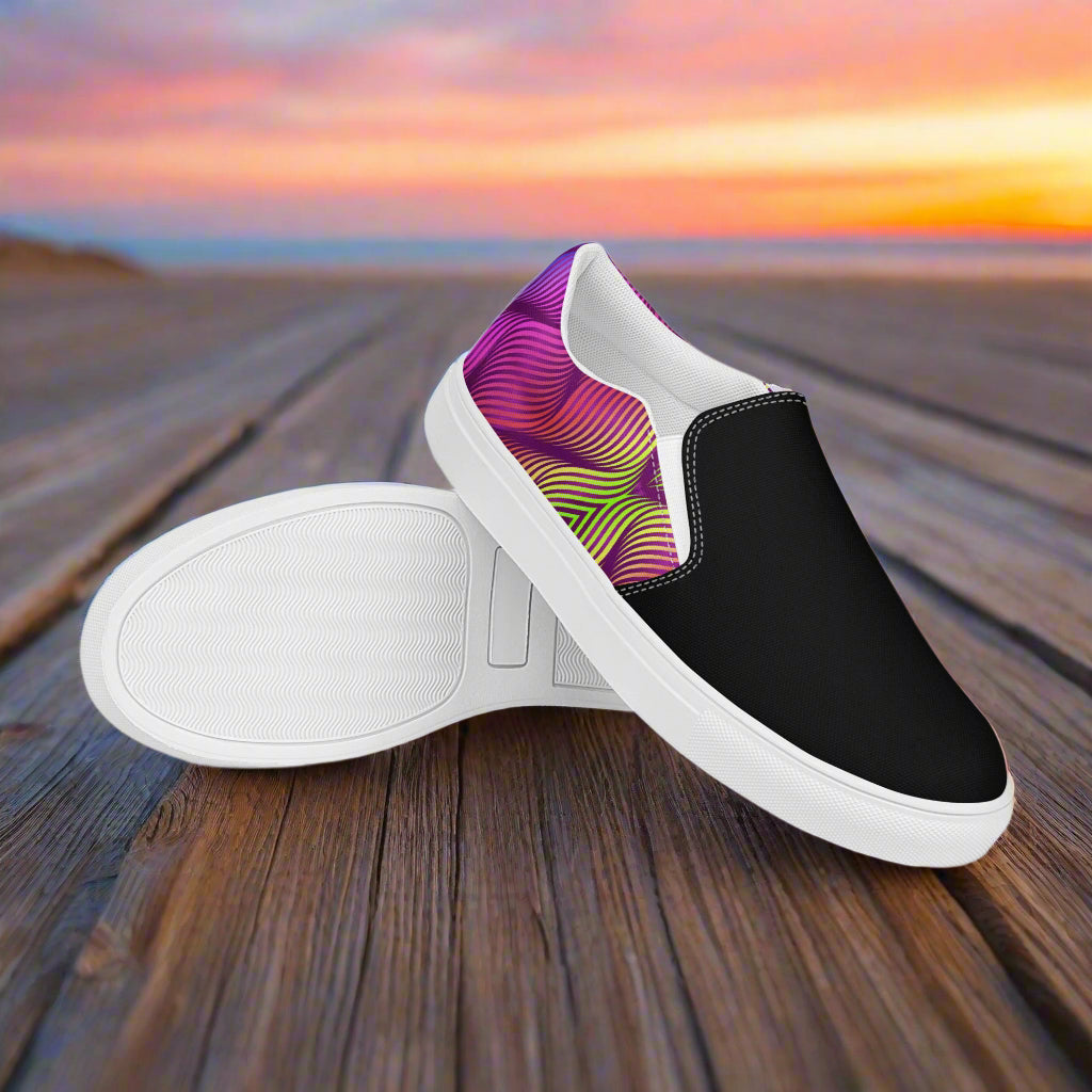 Skater Purple Two Tone Slip-On Canvas Shoes featuring a vibrant pink and black design on a wooden surface