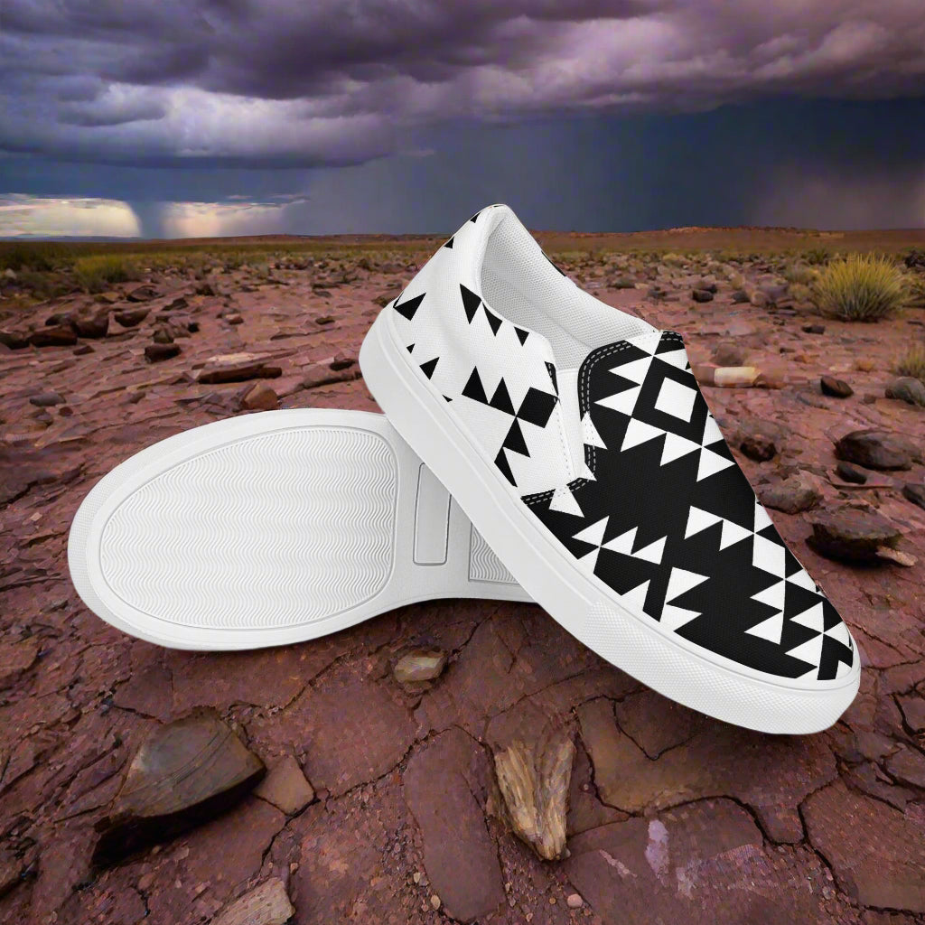 Slip-on Canvas Shoes Sonora Reverse Two Tone with geometric black and white design on a rocky terrain