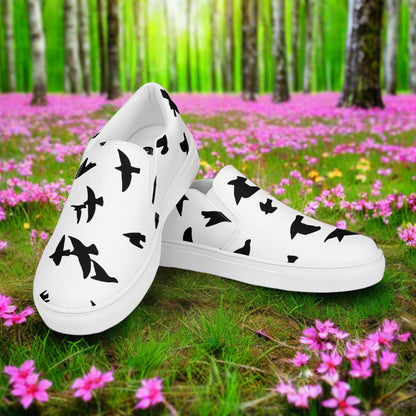 WildSage Market slip on shoes blackbirds pattern white shoes with black bird silhouettes in floral forest setting