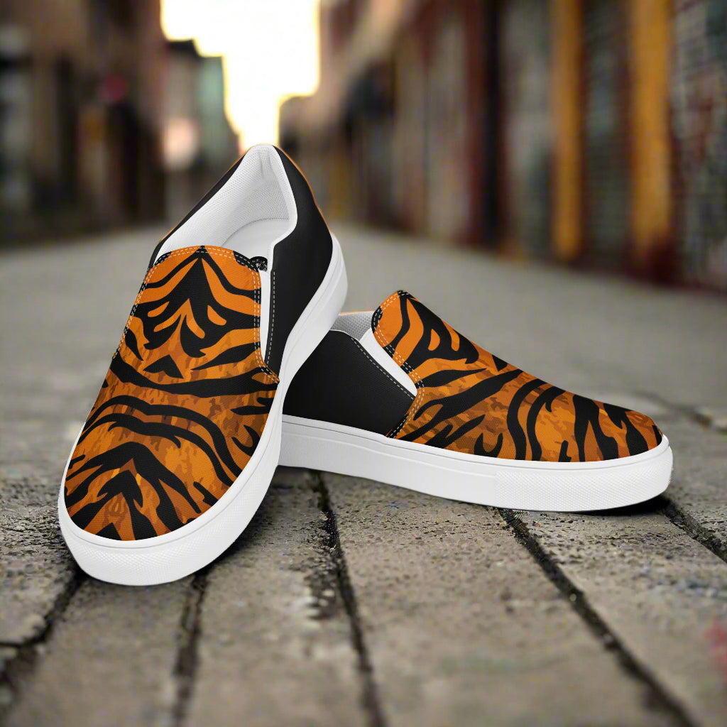 WildSage Market slip on shoes with tiger print halftone design and white soles on street background