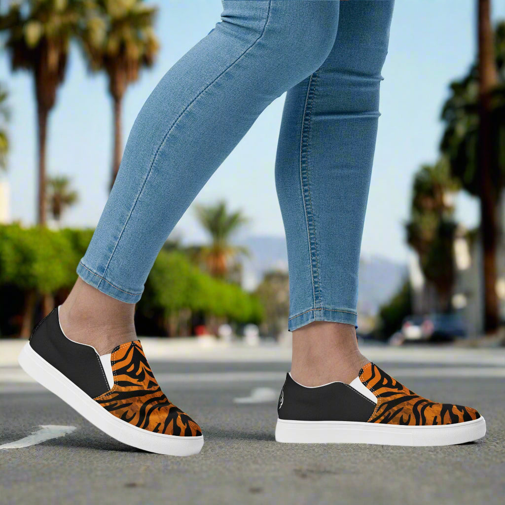 WildSage Market slip on shoes featuring tiger print halftone pattern with black and white accents