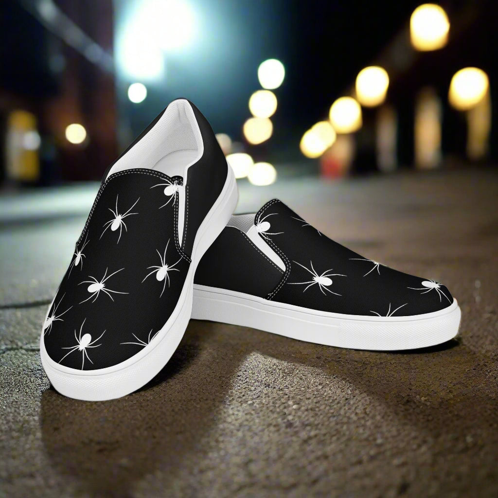 White Spiders Halftone Slip-On Canvas Shoes with a black background and stylish design for casual wear