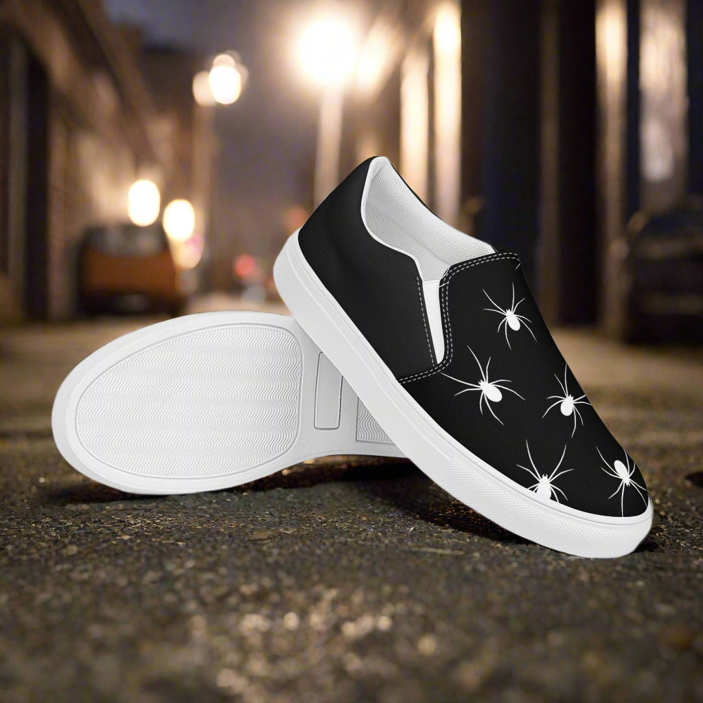 WildSage Market White Spiders Halftone Slip-On Canvas Shoes in black with a stylish spider print