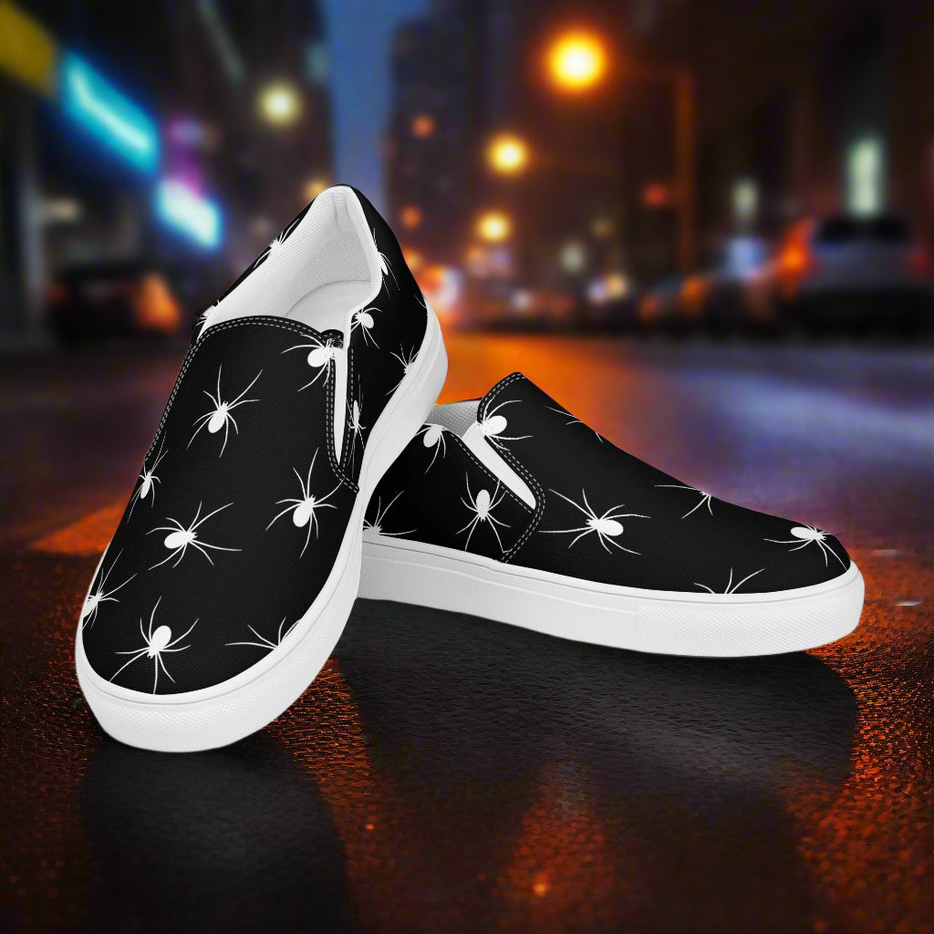 Stylish White Spiders Slip-On Canvas Shoes with a Black Background for a Unique Look