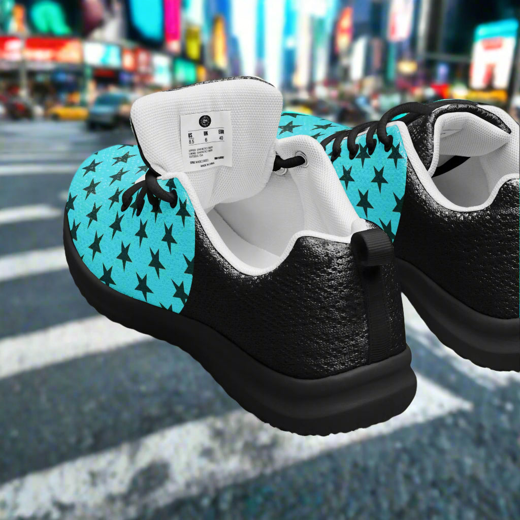 teal two tone athletic shoes with a black star pattern