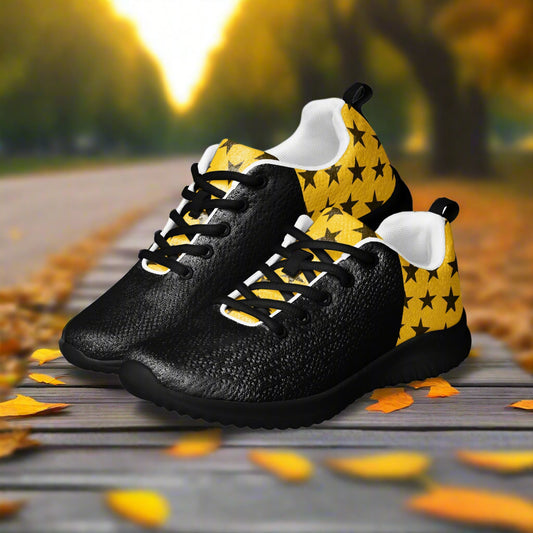 Yellow and black two tone lace up athletic shoes with a black star pattern