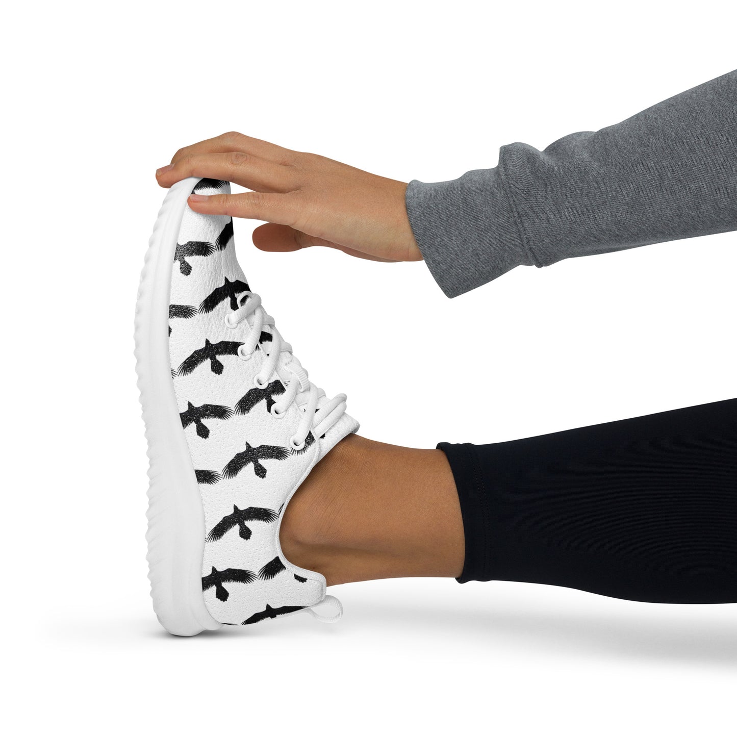WildSage Market womens black raven pattern athletic shoes with white sole worn during stretch