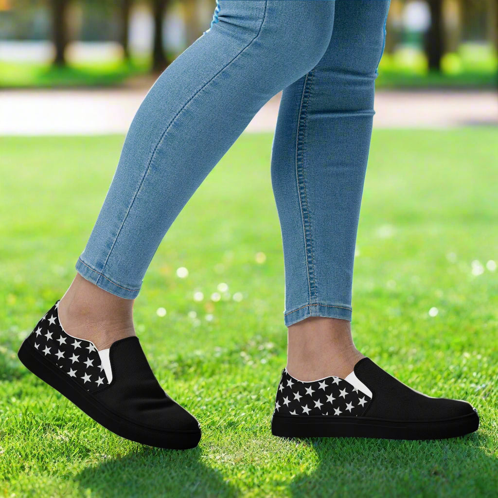 black canvas slip-on shoes with a white star pattern and black toes