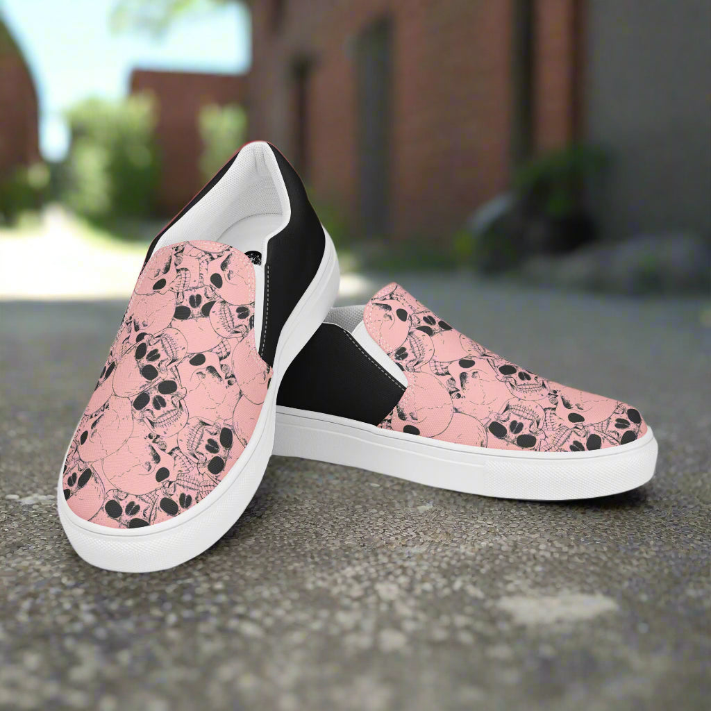 Custom Women's Slip On Canvas Sneakers Pink with Black Outline Skulls Print Two Tone