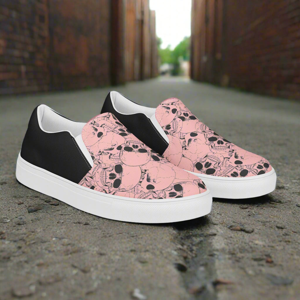 Custom Women's Slip On Canvas Sneakers Pink with Black Outline Skulls Print Two Tone