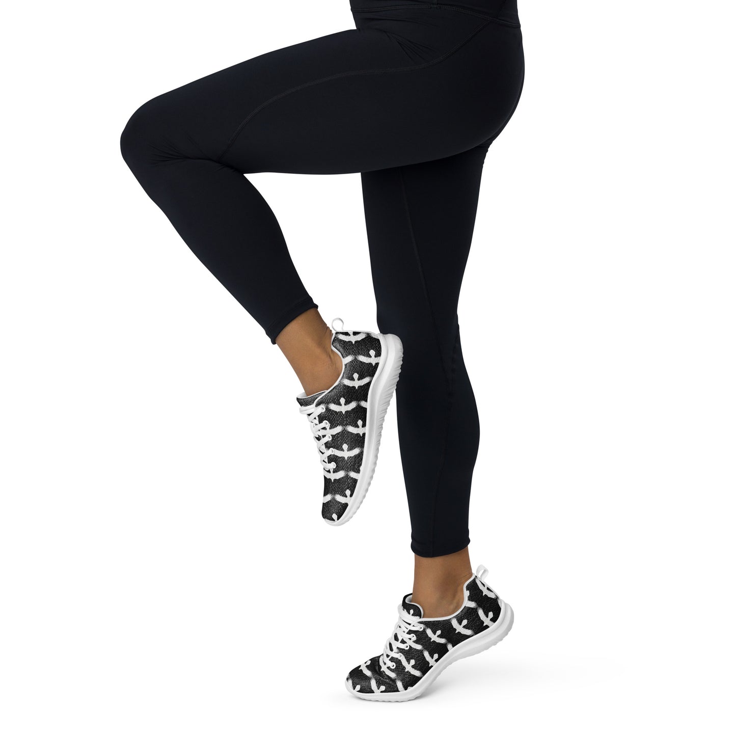 WildSage Market womrns white raven athletic shoes worn with black leggings in active pose
