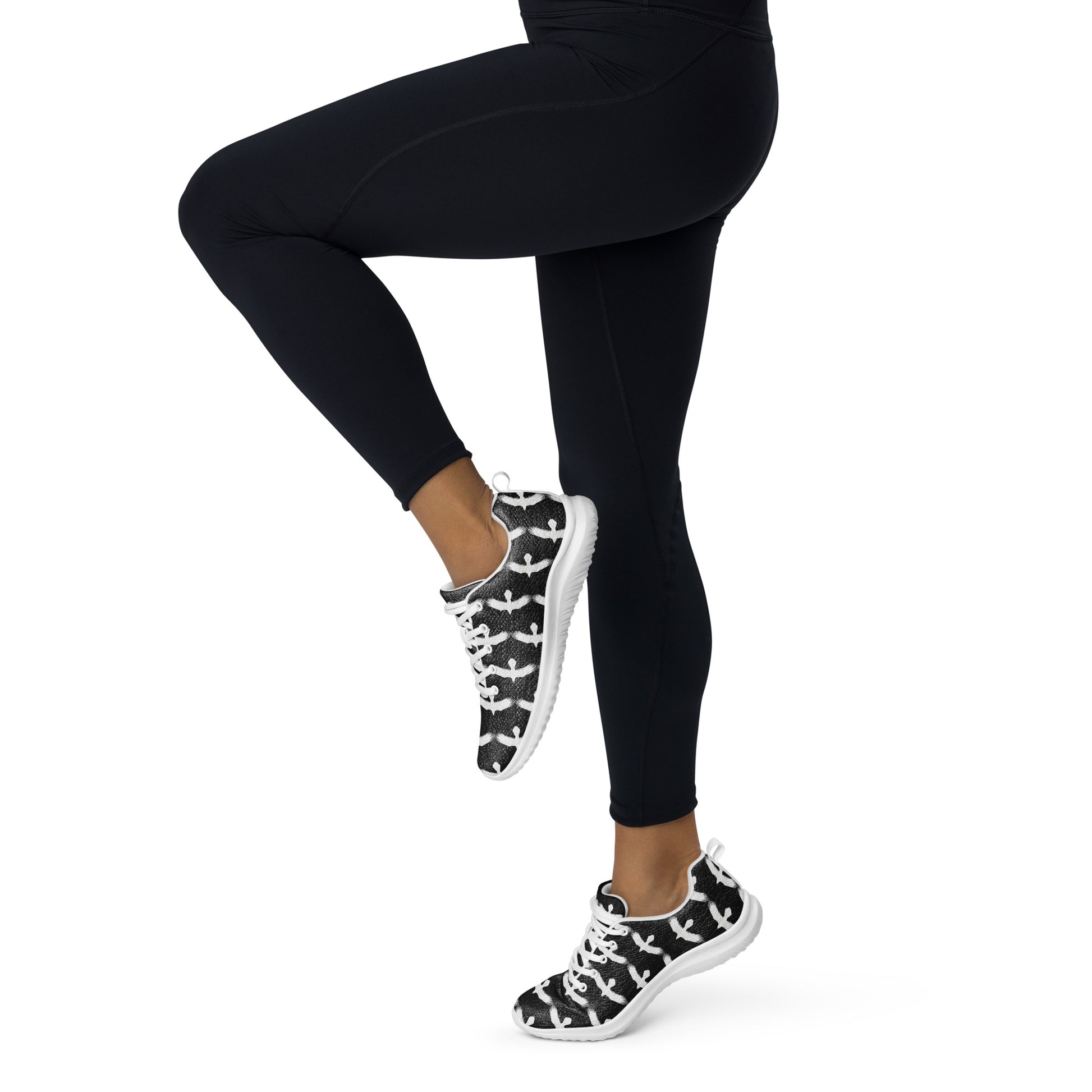 WildSage Market womrns white raven athletic shoes worn with black leggings in active pose