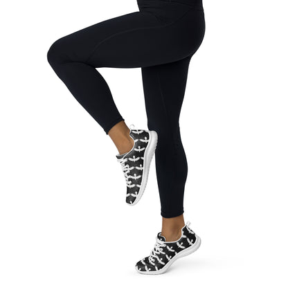 WildSage Market womrns white raven athletic shoes worn with black leggings in active pose